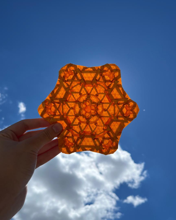 This is one of my latest designs, it’s a tessellation on a 48-division grid in Elephant Hide paper. It’s an expansion of a molecule I created some time ago, developed with the intention of resembling a flower.