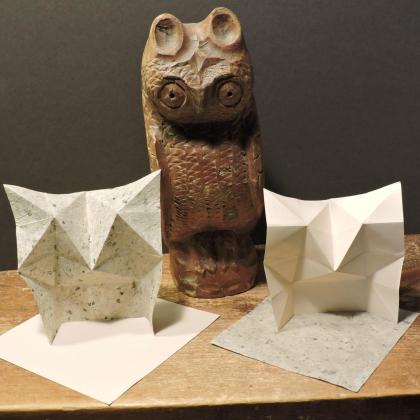 Pureland Owl -two simple abstact owls with a carved wooden owl standing behind them