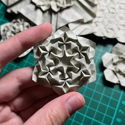 I developed this tessellation without any twists, it uses only valley and mountain folds. If you’d like to try it yourself, the pattern will be published in the Origami USA magazine.