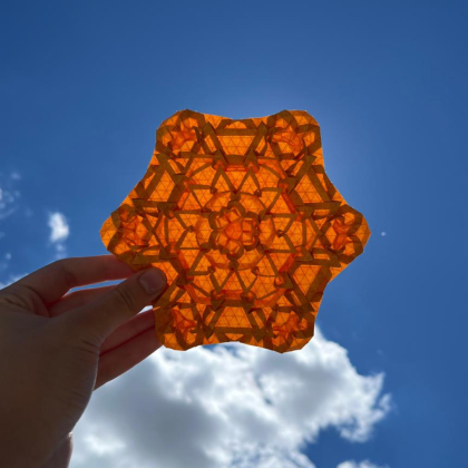 This is one of my latest designs, it’s a tessellation on a 48-division grid in Elephant Hide paper. It’s an expansion of a molecule I created some time ago, developed with the intention of resembling a flower.