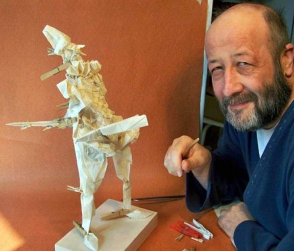 Photo of Eric with an origami model